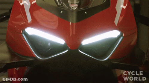 A Close Up Of A Ducati Motorcycle 'S Headlights GIF