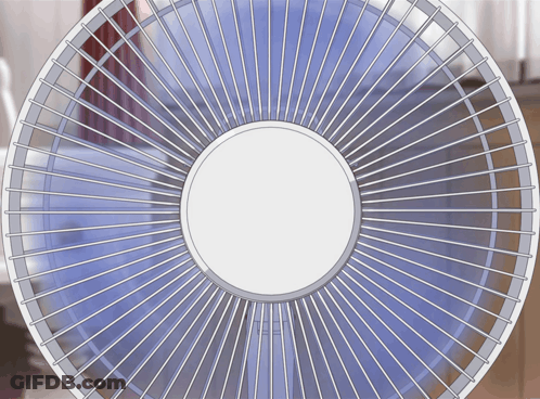 A Close Up Of A Fan With A White Circle In The Center GIF