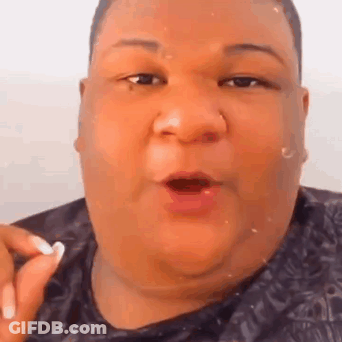 A Close Up Of A Fat Man 'S Face With His Mouth Open And A Nose Ring . GIF