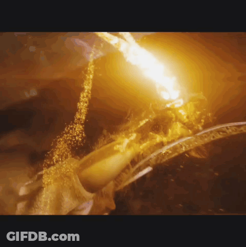 A Close Up Of A Fire Coming Out Of A Hole GIF