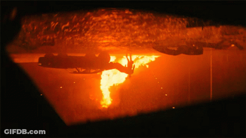 A Close Up Of A Fire Coming Out Of A Hole GIF