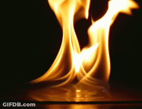 A Close Up Of A Flame On A Black Background GIF