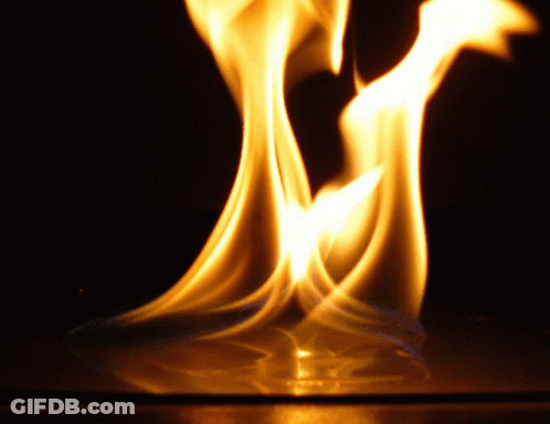 A Close Up Of A Flame With The Letter M Visible GIF