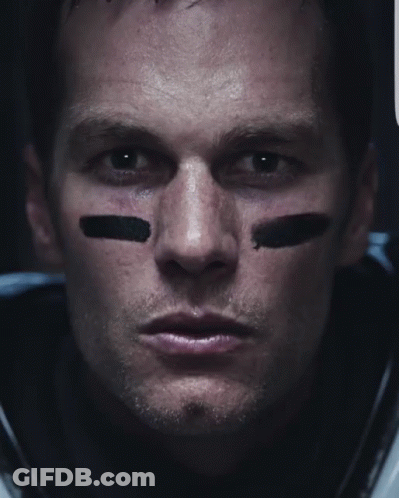 A Close Up Of A Football Player 'S Face With Black Stripes On His Face GIF