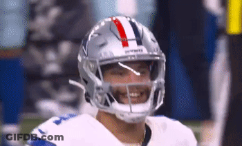 A Close Up Of A Football Player Wearing A Helmet And Smiling GIF