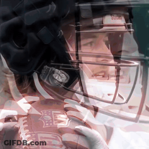 A Close Up Of A Football Player Wearing A Helmet That Says NFL GIF