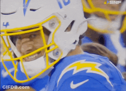A Close Up Of A Football Player Wearing A Helmet With The Number 10 On It GIF