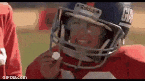 A Close Up Of A Football Player Wearing A Helmet With The Word Raiders On It GIF