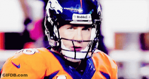 A Close Up Of A Football Player Wearing A Riddell Helmet GIF