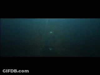 A Close Up Of A Foreign Language Written On A Black Surface GIF