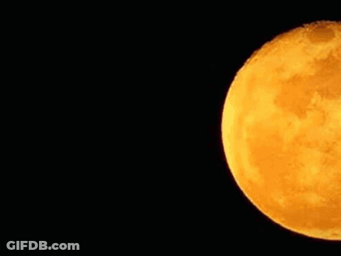 A Close Up Of A Full Moon In The Night Sky . GIF
