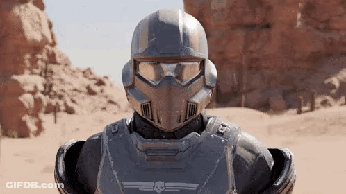 A Close Up Of A Futuristic Soldier Wearing A Helmet And Goggles In A Desert . GIF