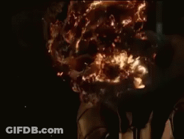 A Close Up Of A Ghost Rider 'S Head With Fire Coming Out Of It . GIF