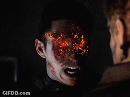 A Close Up Of A Ghost Rider With Fire Coming Out Of His Face GIF