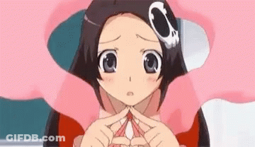 A Close Up Of A Girl Making A Heart With Her Hands . GIF
