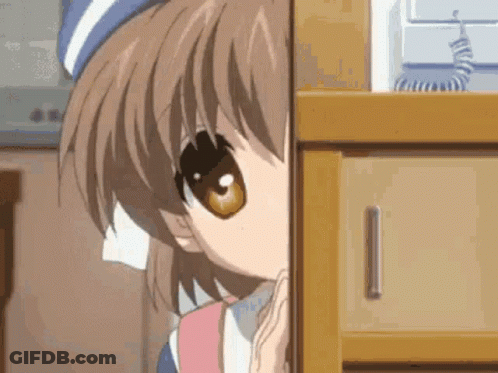 A Close Up Of A Girl Peeking Out From Behind A Dresser . GIF