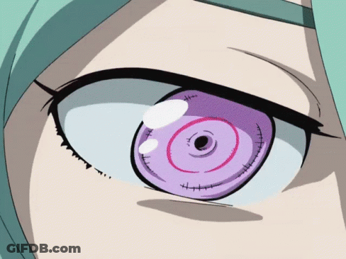 A Close Up Of A Girl 'S Eye With A Purple Circle In The Middle GIF