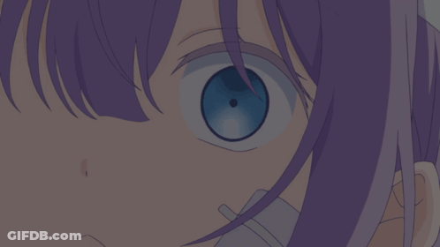 A Close Up Of A Girl 'S Eye With Purple Hair GIF