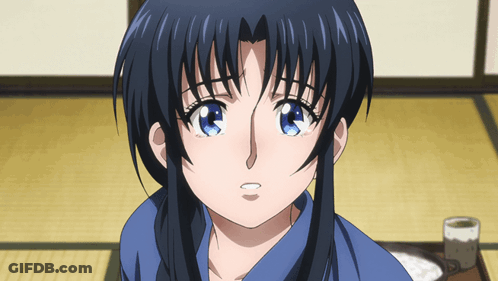 A Close Up Of A Girl 'S Face With A Blue Shirt On GIF