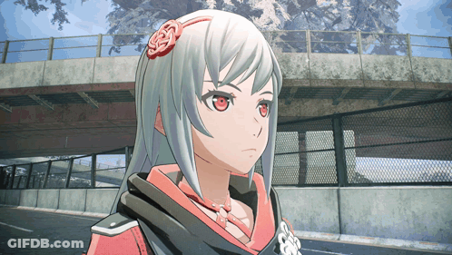 A Close Up Of A Girl 'S Face With A Fence In The Background GIF
