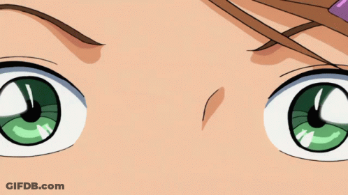 A Close Up Of A Girl 'S Face With A Flower In Her Hair GIF