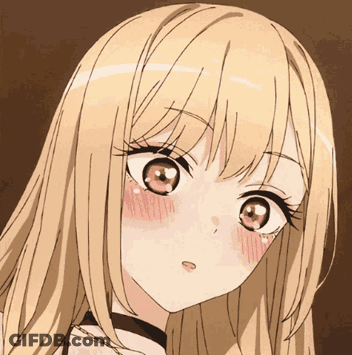 A Close Up Of A Girl 'S Face With A Heart Shaped Eye GIF