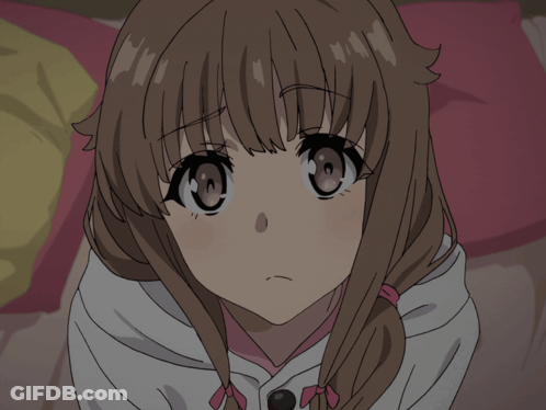 A Close Up Of A Girl 'S Face With A Pink Bow In Her Hair GIF
