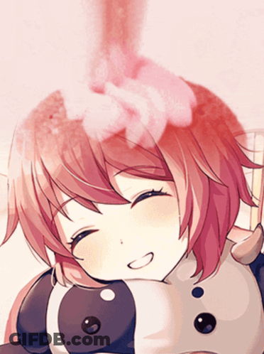 A Close Up Of A Girl 'S Face With A Pink Flower In Her Hair GIF