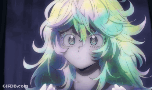 A Close Up Of A Girl 'S Face With A Rainbow Colored Hair GIF