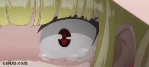 A Close Up Of A Girl 'S Face With A Red Eye And Tears Coming Out Of Her Eyes . GIF
