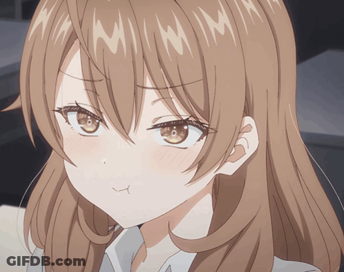 A Close Up Of A Girl 'S Face With A Slight Smile On Her Face GIF