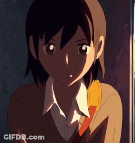 A Close Up Of A Girl 'S Face With A Yellow Scarf Around Her Neck GIF