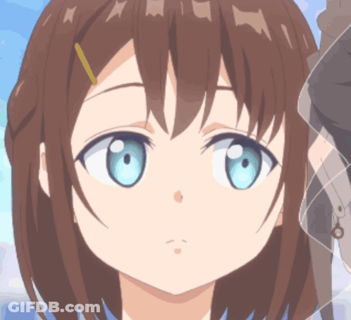 A Close Up Of A Girl 'S Face With Blue Eyes And Brown Hair GIF