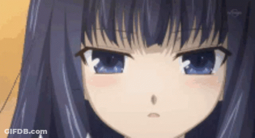 A Close Up Of A Girl 'S Face With Blue Eyes And Purple Hair . GIF