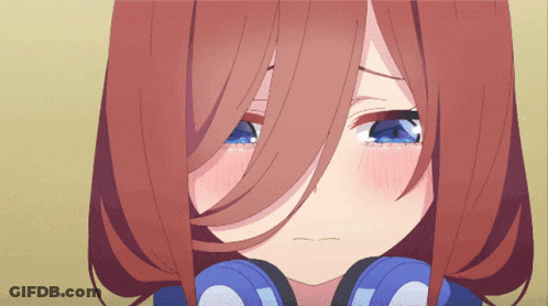 A Close Up Of A Girl 'S Face With Blue Eyes GIF