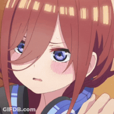A Close Up Of A Girl 'S Face With Blue Eyes GIF