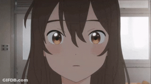 A Close Up Of A Girl 'S Face With Brown Eyes And Long Hair GIF