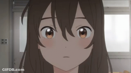 A Close Up Of A Girl 'S Face With Brown Eyes And Long Hair GIF
