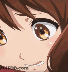 A Close Up Of A Girl 'S Face With Brown Hair GIF