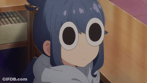A Close Up Of A Girl 'S Face With Circles In Her Eyes GIF