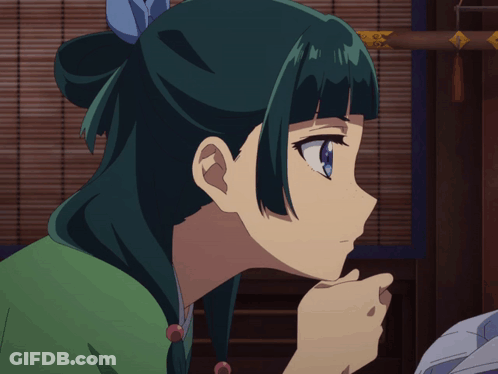 A Close Up Of A Girl 'S Face With Green Hair GIF