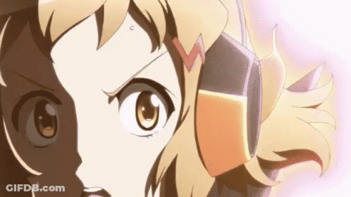 A Close Up Of A Girl 'S Face With Headphones On . GIF