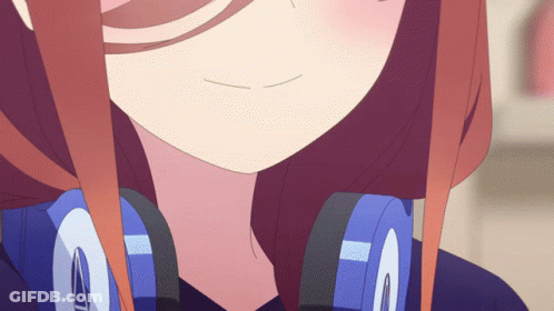 A Close Up Of A Girl 'S Face With Headphones On GIF