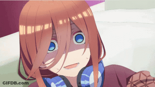 A Close Up Of A Girl 'S Face With Headphones On GIF