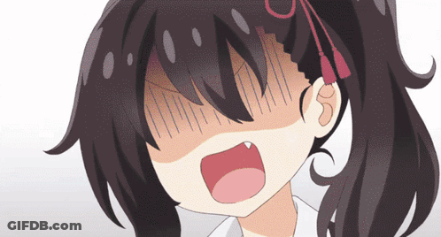 A Close Up Of A Girl 'S Face With Her Mouth Wide Open GIF
