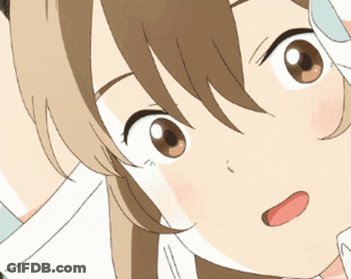 A Close Up Of A Girl 'S Face With Her Tongue Sticking Out GIF