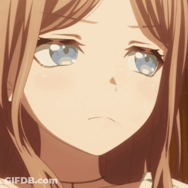 A Close Up Of A Girl 'S Face With Long Brown Hair And Blue Eyes GIF