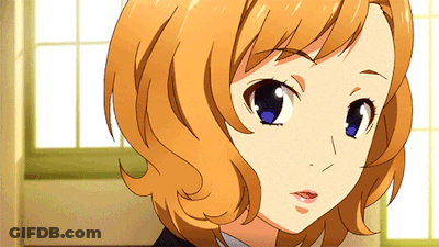 A Close Up Of A Girl 'S Face With Orange Hair GIF