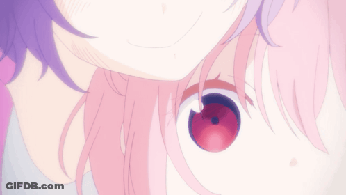 A Close Up Of A Girl 'S Face With Pink Hair GIF