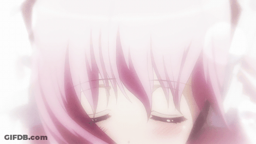 A Close Up Of A Girl 'S Face With Pink Hair And Black Eyes GIF
